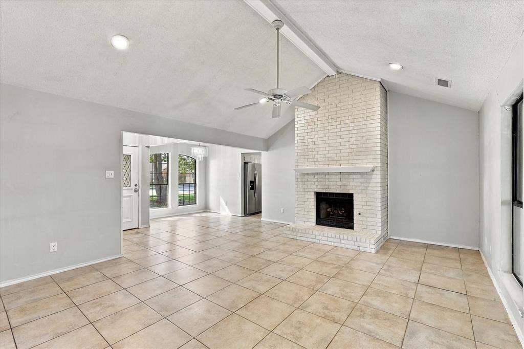 2315 Highridge Drive, Sachse, TX 75048 Large spacious family room with vaulted ceilings and fireplace.
