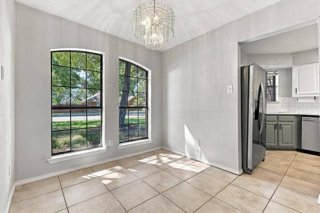 2315 Highridge Drive, Sachse, TX 75048 Dining room space with large window letting in natural light!