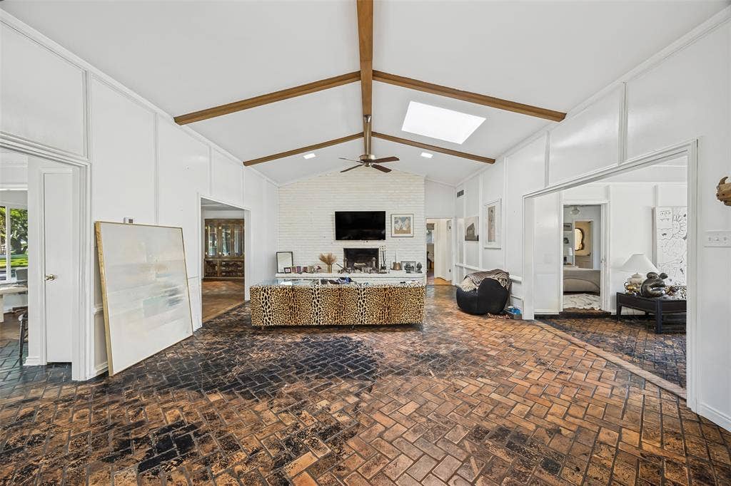 7257 Stefani Drive, Dallas, TX 75225 View of Den with Entry and Living Room to the left and Sun Room to the right.
