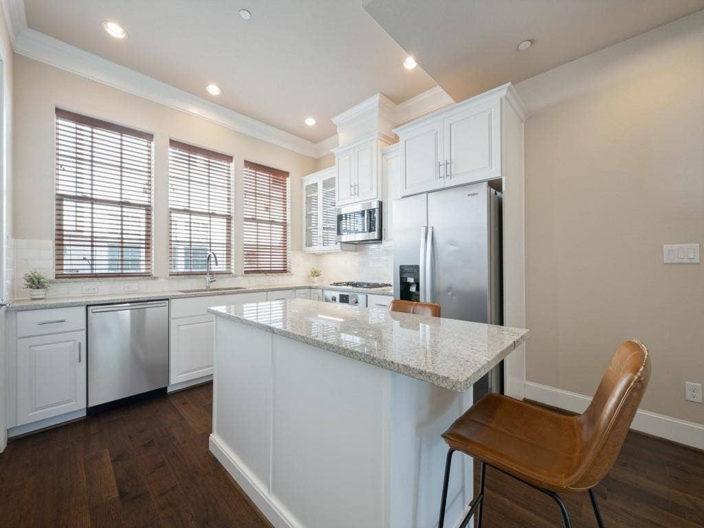 7333 Valley View Lane, #805, Dallas, TX 75240 The Gourmet Kitchen Features Bosch Appliances, Granite Counters, and Shaker Style Cabinets, Along with a Walk-in Pantry