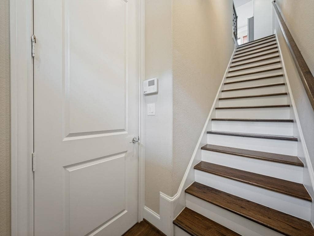 7333 Valley View Lane, #805, Dallas, TX 75240 Wood Capped Stairs Greet You Upon Entry
