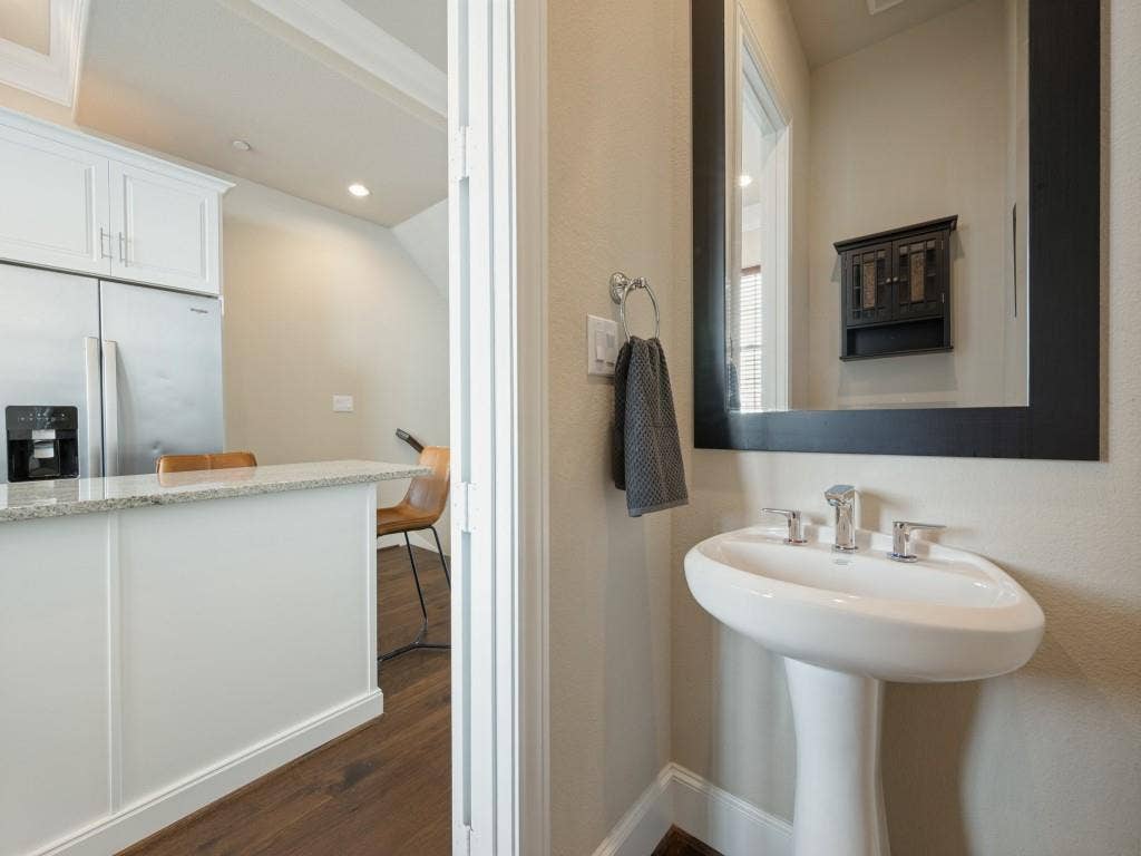 7333 Valley View Lane, #805, Dallas, TX 75240 You Will Find a Half Bath on the Second Floor for Guests