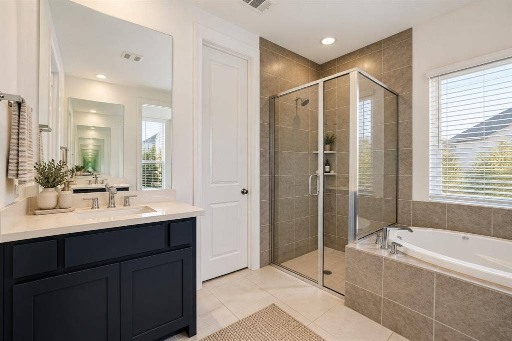 2836 Epping Way, Celina, TX 75009 Spacious primary bathroom featuring separate vanities for added comfort and convenience.