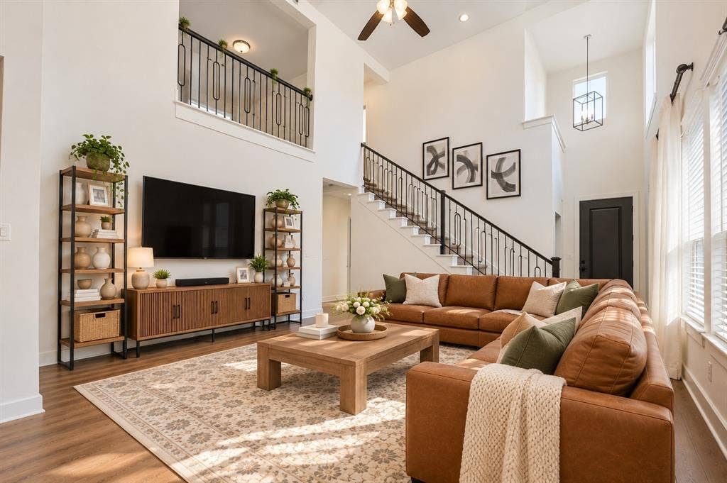 2836 Epping Way, Celina, TX 75009 Spacious open-concept living room with soaring ceilings, abundant natural light, and seamless flow into the kitchen and dining areas.