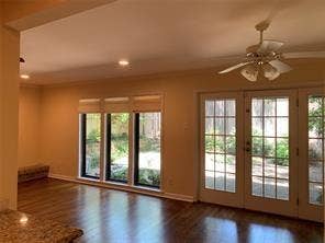 6949 Helsem Way, #131, Dallas, TX 75230 view of den with breakfast area enjoys private courtyard