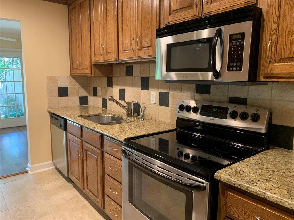 6949 Helsem Way, #131, Dallas, TX 75230 plenty of cabinet space and granite counters