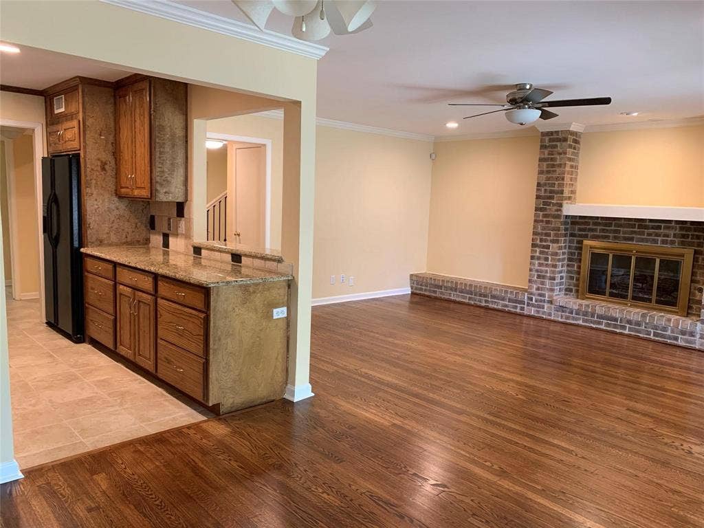 6949 Helsem Way, #131, Dallas, TX 75230 view of den and kitchen from breakfast room