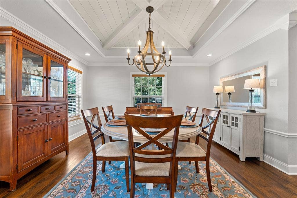 200 Oriental Road, Waco, TX 76710 Dining space featuring a coffered ceiling with a central cross-beam design, a multi-arm iron chandelier, wood-finish flooring, and crown molding