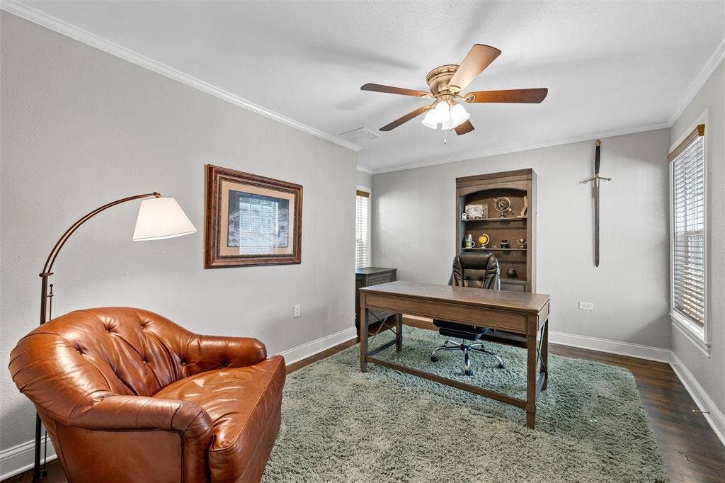200 Oriental Road, Waco, TX 76710 Room featuring wood-finish flooring, built-in shelving, a ceiling fan with light fixture, and windows with horizontal blinds