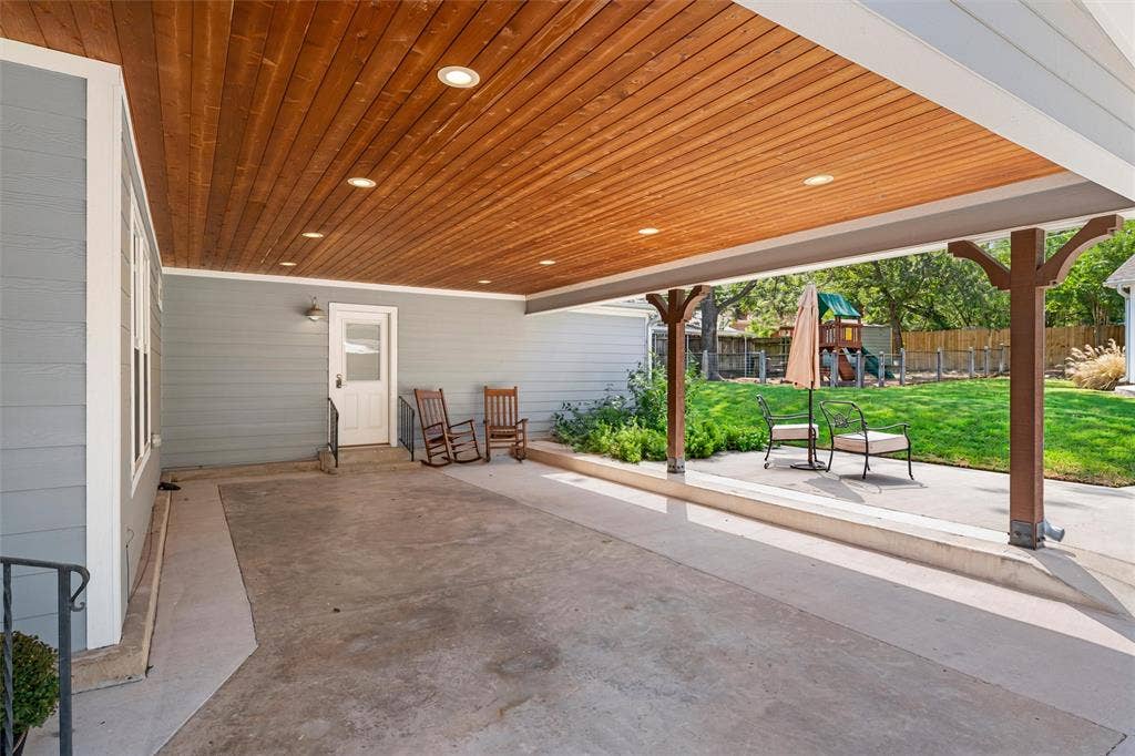 200 Oriental Road, Waco, TX 76710 Covered patio featuring a wood-plank ceiling with recessed lighting, concrete flooring, and decorative timber support columns