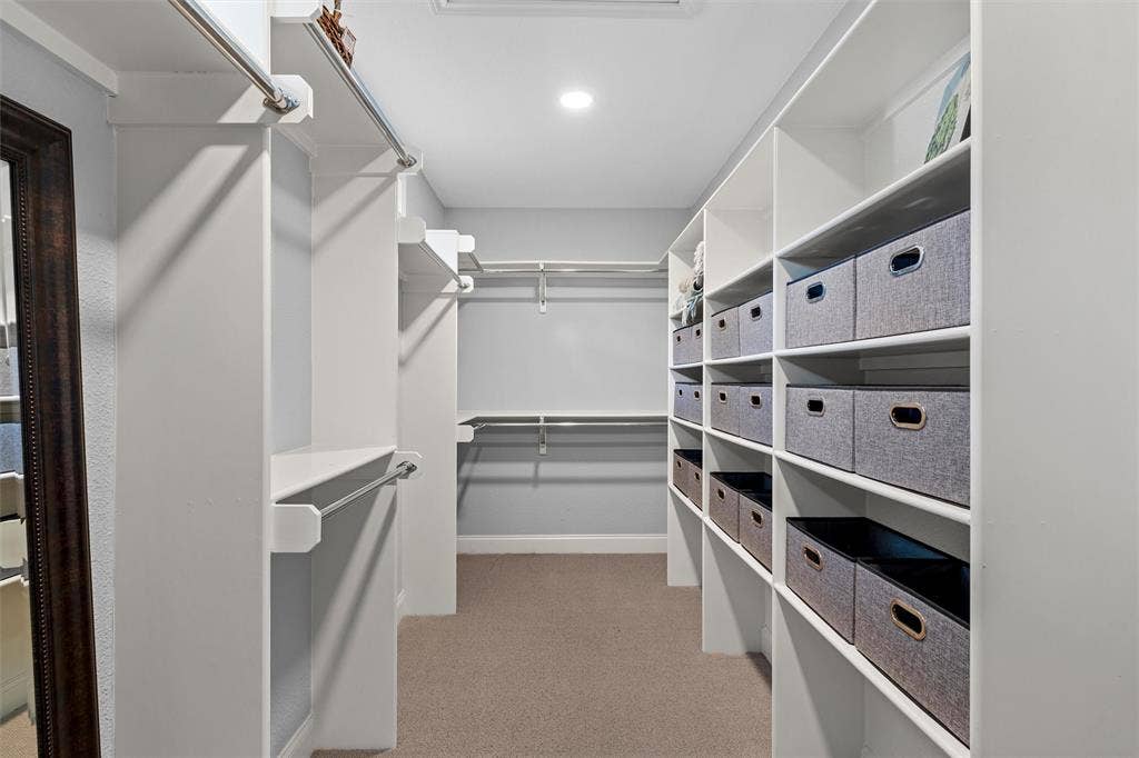 200 Oriental Road, Waco, TX 76710 Walk-in closet featuring extensive built-in white shelving, multiple hanging rods, and recessed lighting