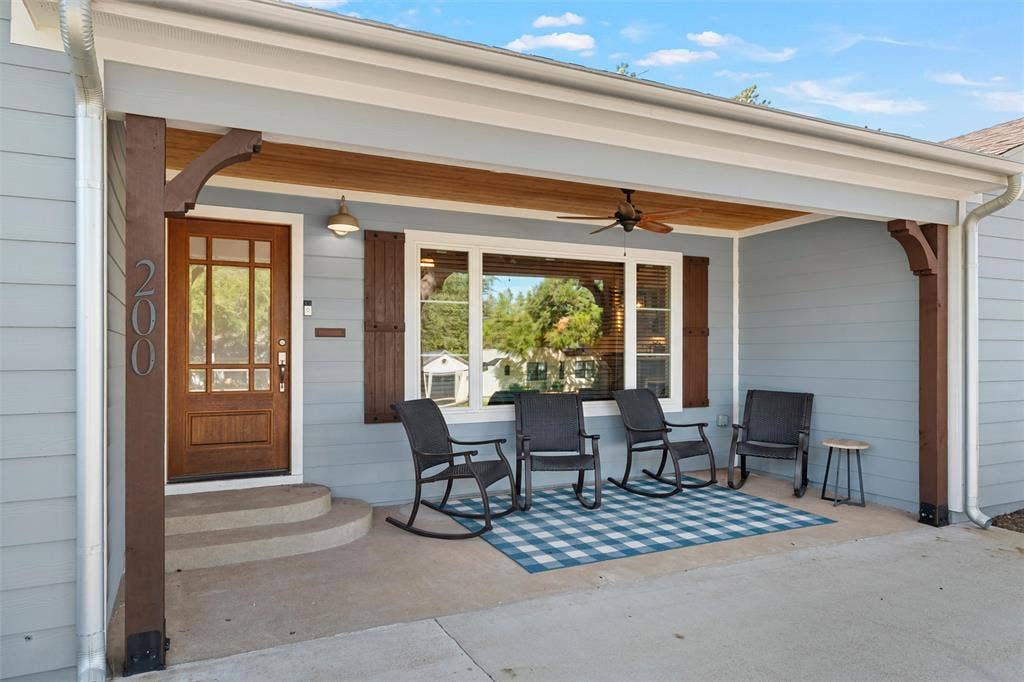 200 Oriental Road, Waco, TX 76710 Covered front porch featuring wood-finish ceiling detailing, decorative corbels, horizontal siding, and a multi-pane wood entry door