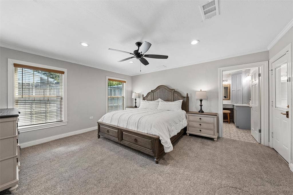 200 Oriental Road, Waco, TX 76710 Neutral-toned interior featuring wall-to-wall carpeting, recessed lighting, crown molding, a central ceiling fan, and dual windows