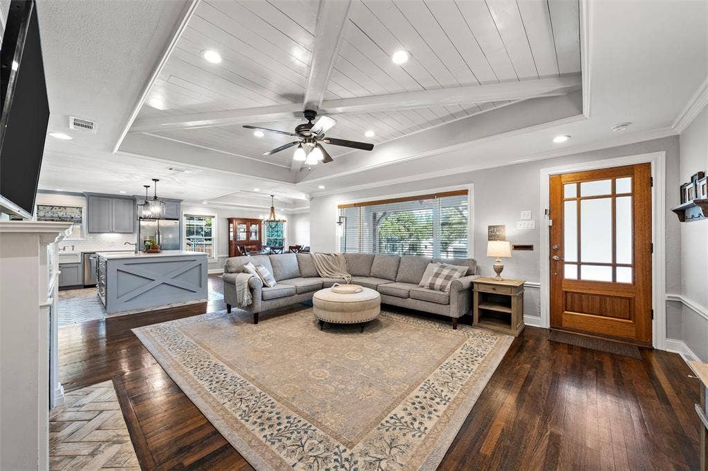 200 Oriental Road, Waco, TX 76710 Tray ceiling with planked detail, wood-finish flooring, central ceiling fan with integrated lighting, recessed lighting, and a multi-pane glass-panel entry door