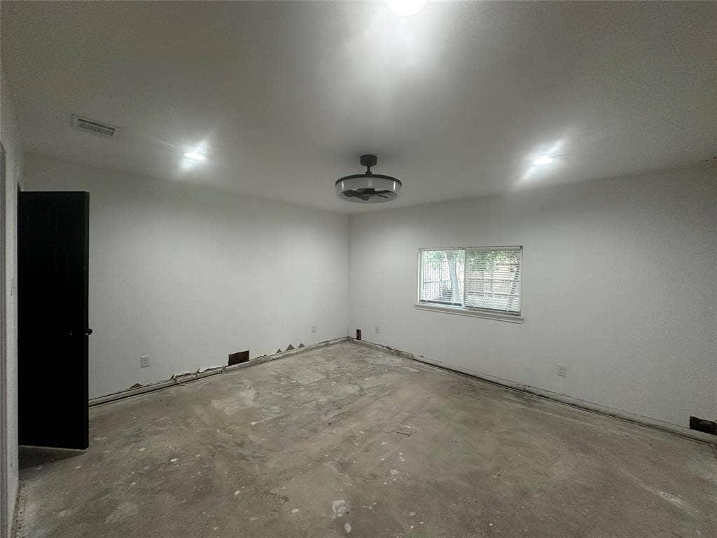 4808 Sandra Lynn Drive, Mesquite, TX 75150 Interior space featuring recessed lighting, a ceiling fan with integrated light fixture, a horizontal sliding window, and a contrasting black interior door