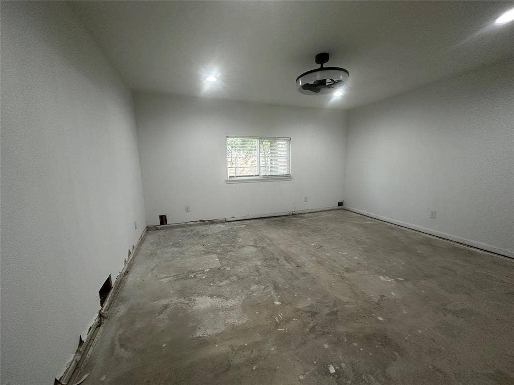 4808 Sandra Lynn Drive, Mesquite, TX 75150 Interior space featuring neutral wall paint, recessed lighting, a ceiling-mounted light fixture, and a sliding window