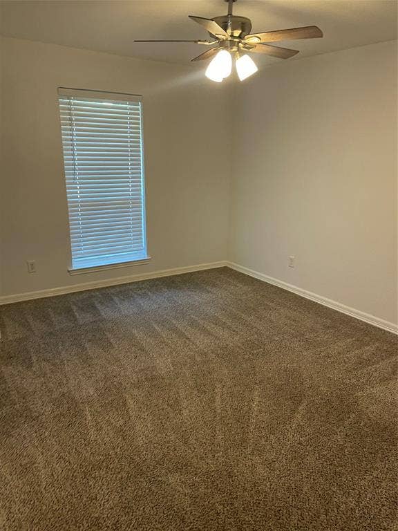 1423 Northridge Drive, Carrollton, TX 75006 Neutral interior space featuring wall-to-wall carpeting, a multi-blade ceiling fan with integrated light fixture, and a single window with horizontal blinds
