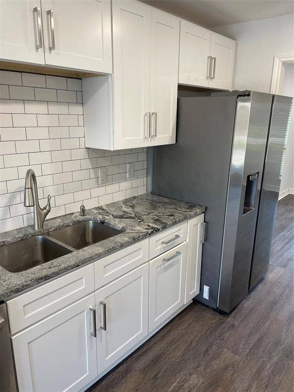 1423 Northridge Drive, Carrollton, TX 75006 Kitchen featuring white shaker-style cabinetry, stone countertops, stainless steel dual-basin sink with arched faucet, subway tile backsplash, and wood-finish flooring