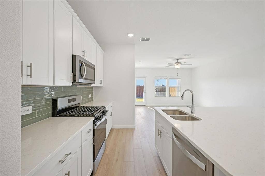 104 Decoursey Drive, Princeton, TX 75071 Photo is not of the actual home, but is an inspirational photo of builder’s model home and may depict options, furnishings, and/or decorator features that are not included.