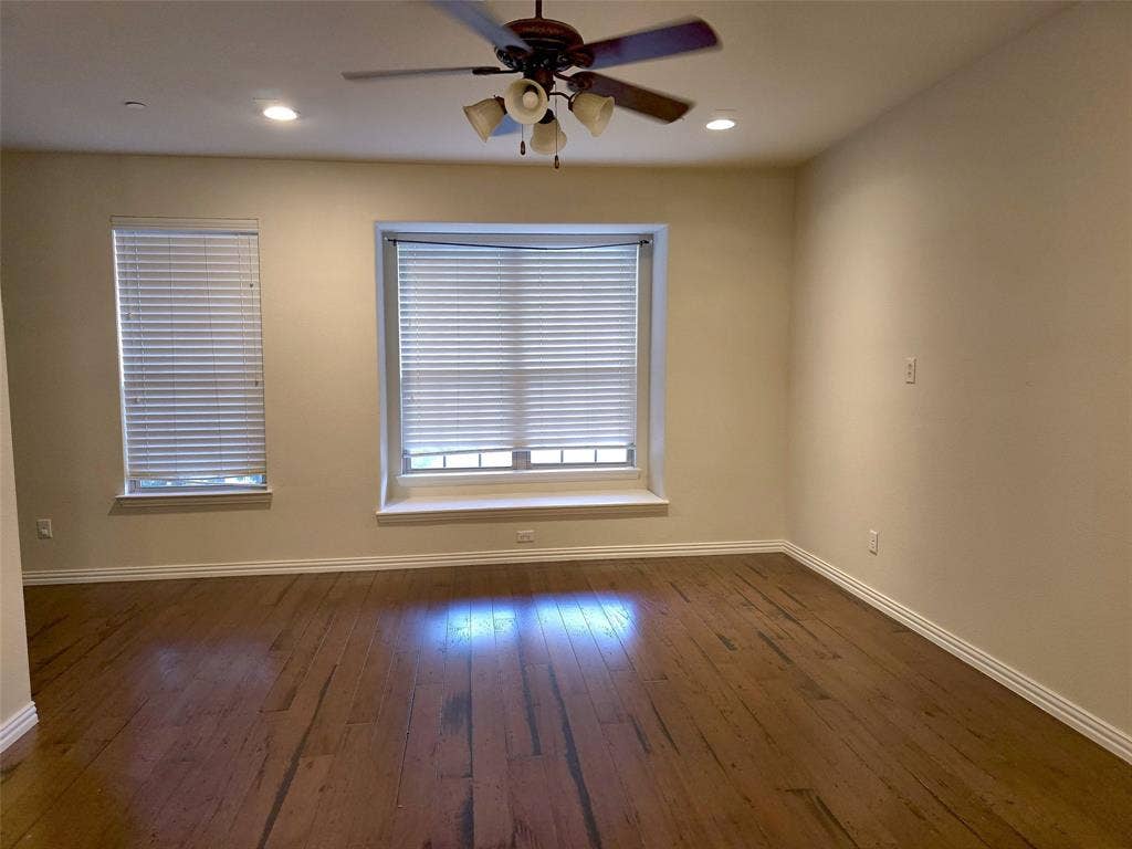 1504 Fox Run Drive, Irving, TX 75063 Room featuring wood-finish flooring, recessed lighting, a ceiling fan with integrated lighting, and a bay window with a sill