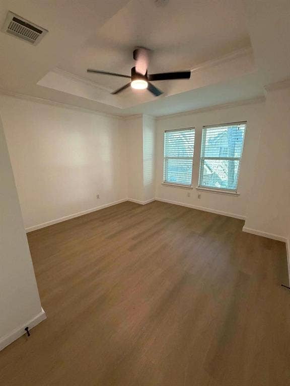 5864 Oram Street, Dallas, TX 75206 2nd Bedroom with tray ceiling, wood-finish flooring, and a modern ceiling fan with integrated lighting