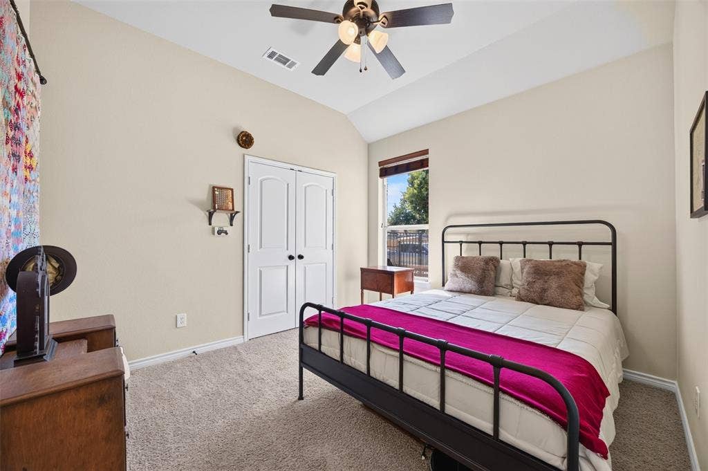1514 Natalie Lane, Duncanville, TX 75137 Vaulted ceilings, neutral carpeting, double-door closet, and overhead ceiling fan with light fixture
