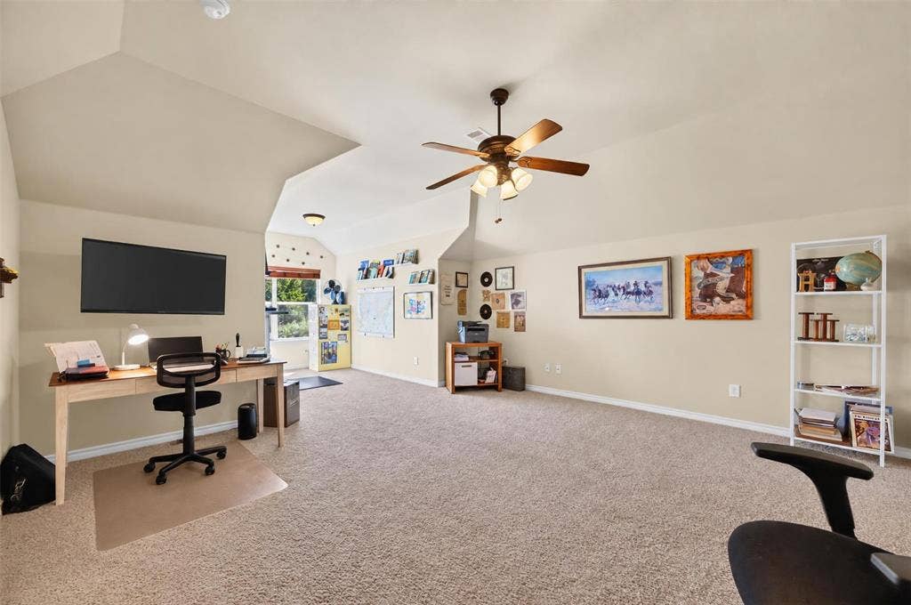 1514 Natalie Lane, Duncanville, TX 75137 Vaulted ceiling, wall-to-wall carpeting, and a multi-blade ceiling fan with integrated lighting