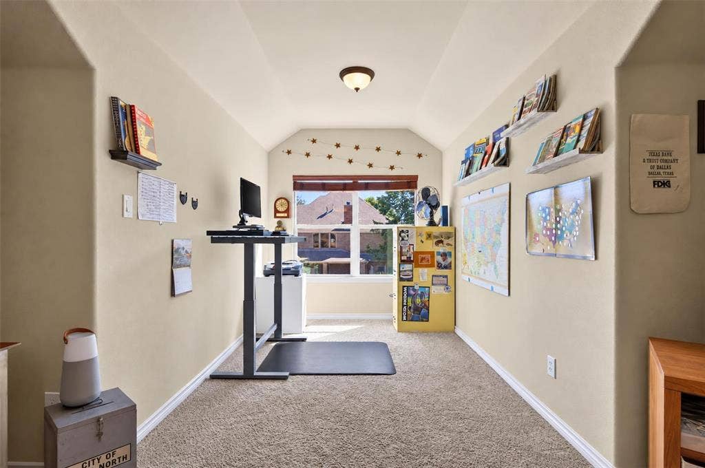 1514 Natalie Lane, Duncanville, TX 75137 Vaulted ceiling with integrated flush-mount lighting, carpeted flooring, and a window providing natural light