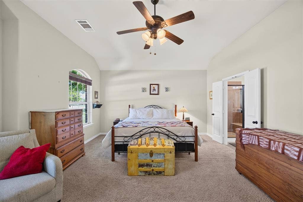 1514 Natalie Lane, Duncanville, TX 75137 Vaulted ceilings, carpeting, arched window, and integrated multi-blade ceiling fan with light fixture