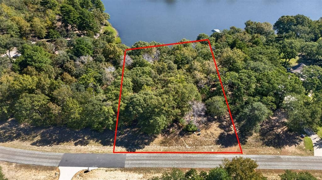 0 Safari Shores Drive, Larue, TX 75770 Wooded parcel featuring direct water frontage and mature trees