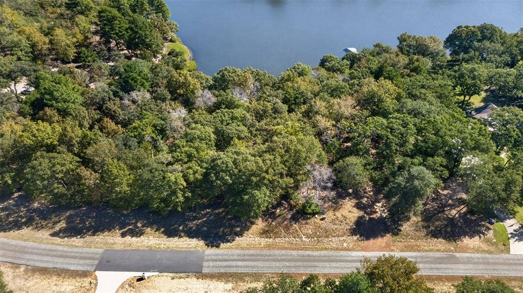 0 Safari Shores Drive, Larue, TX 75770 Waterfront lot featuring mature tree canopy, varied topography, and direct access to the water's edge
