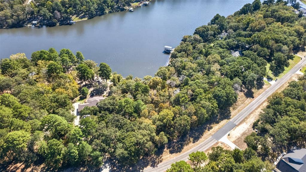 0 Safari Shores Drive, Larue, TX 75770 Waterfront parcel featuring extensive tree coverage and direct shoreline access