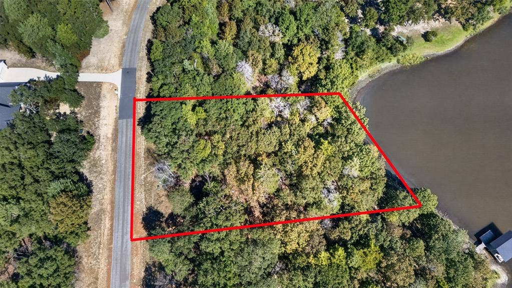 0 Safari Shores Drive, Larue, TX 75770 Wooded residential lot featuring extensive shoreline and direct paved road access