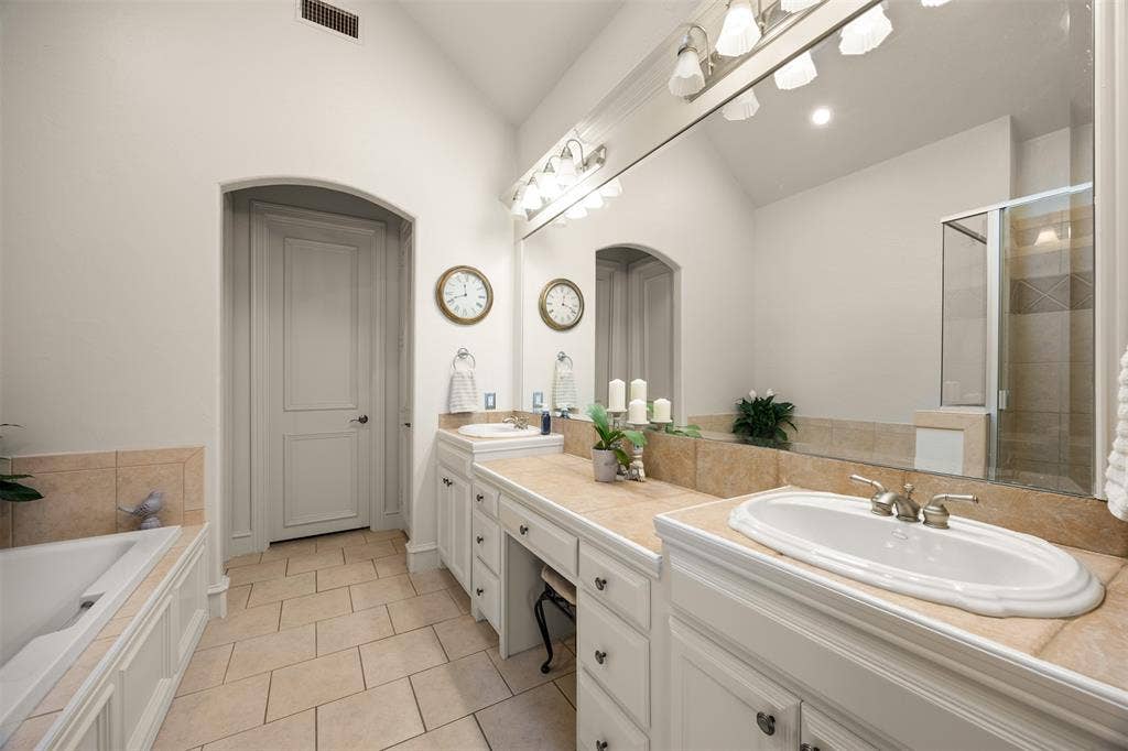 1516 Hackett Creek Drive, McKinney, TX 75072 Spa-like primary bath has dual sinks and more.