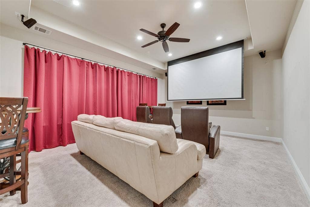 7231 Judy Drive, Ovilla, TX 75154 Media room featuring a retractable projection screen, ceiling fan, recessed lighting, and wall-mounted audio speakers
