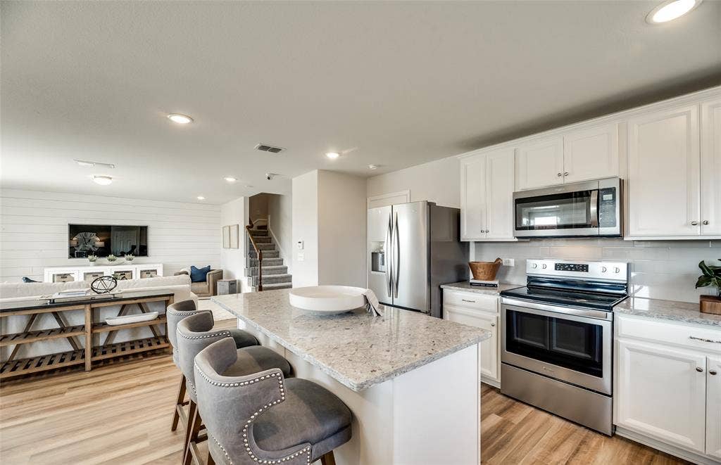 1054 Clear Dusk Lane, Forney, TX 75126 *Model Representation - Large island gathering room and dining areas overlooking