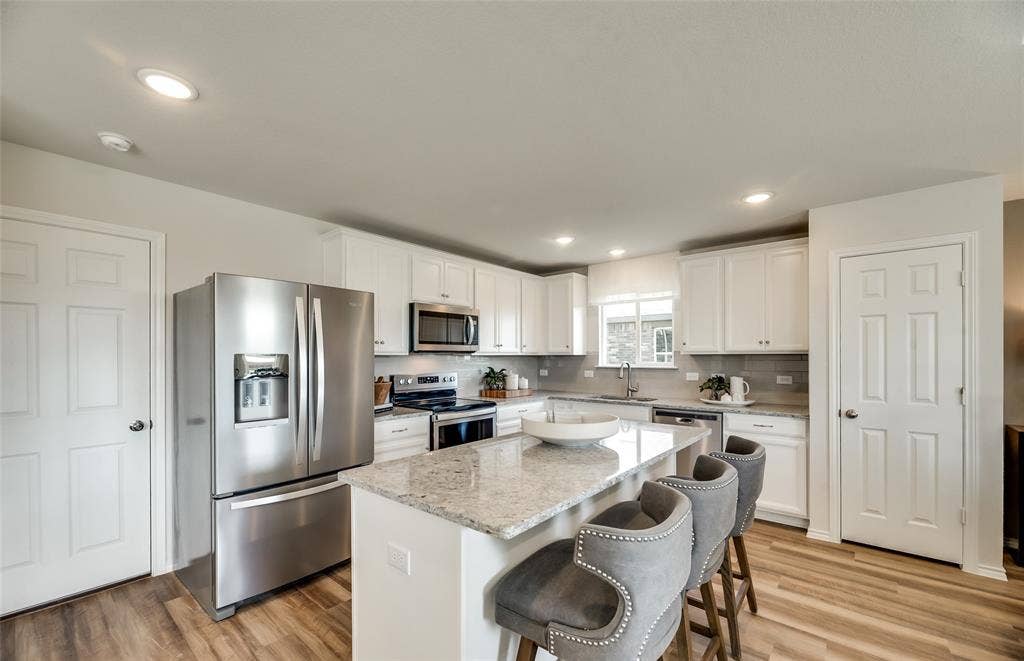 1054 Clear Dusk Lane, Forney, TX 75126 *Model Representation - Spacious kitchen with eat-in bartop island