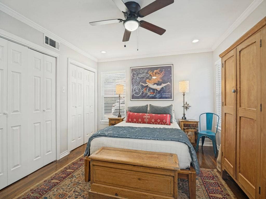 200 S Weatherred Drive, Richardson, TX 75080 Wood-finish flooring, dual bi-fold door closets, recessed lighting, and a ceiling fan with integrated light fixture