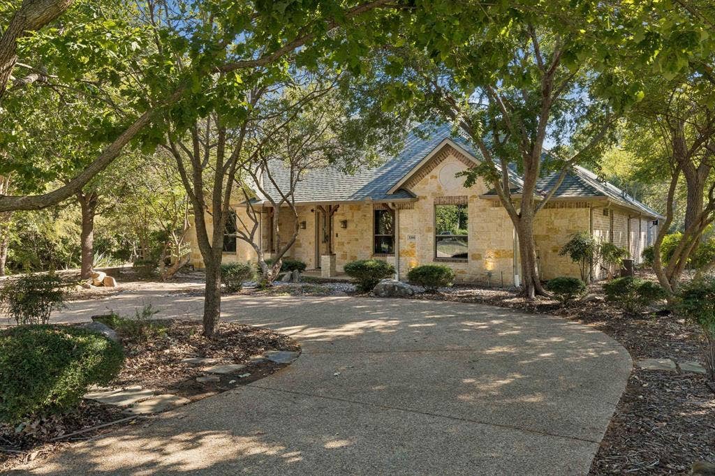 186 Moonlight Drive, Murphy, TX 75094 Front of home with circular driveway