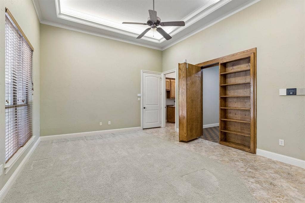 186 Moonlight Drive, Murphy, TX 75094 Formal living room and behind the bookcase is the perfect room for storage