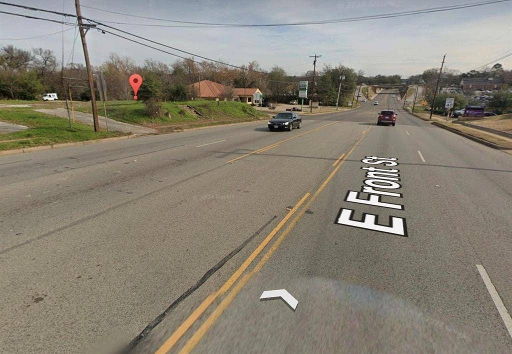Corner lot featuring direct street frontage, clear topography, and established curb cuts