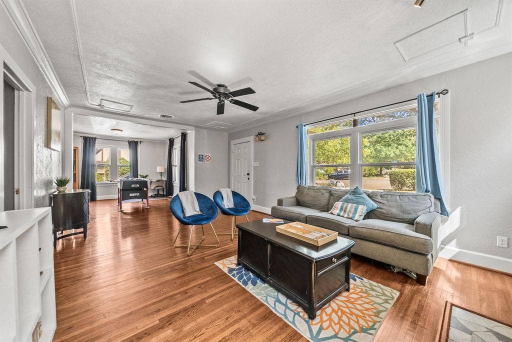 2807 Cain Boulevard, Dallas, TX 75211 Hardwood flooring, crown molding, ceiling fan, and large windows