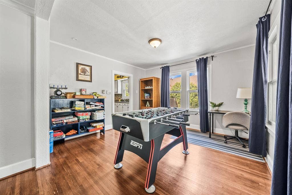 2807 Cain Boulevard, Dallas, TX 75211 Polished wood-finish flooring, ample natural light from multiple windows, and recessed ceiling fixture