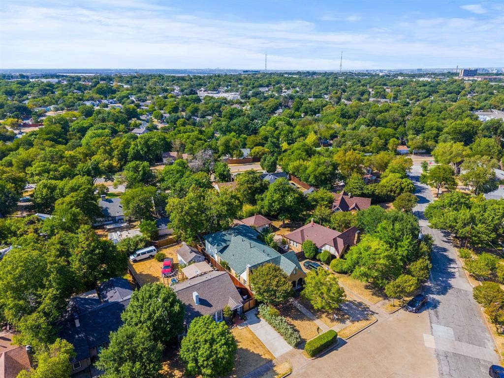 2807 Cain Boulevard, Dallas, TX 75211 Aerial perspective showcasing the residential street, mature trees, and numerous properties