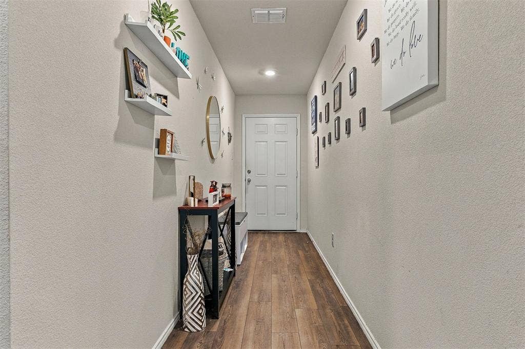 1516 Stonefield Drive, Anna, TX 75409 Entryway featuring wood-finish flooring, neutral wall tones, recessed lighting, and wall-mounted shelving