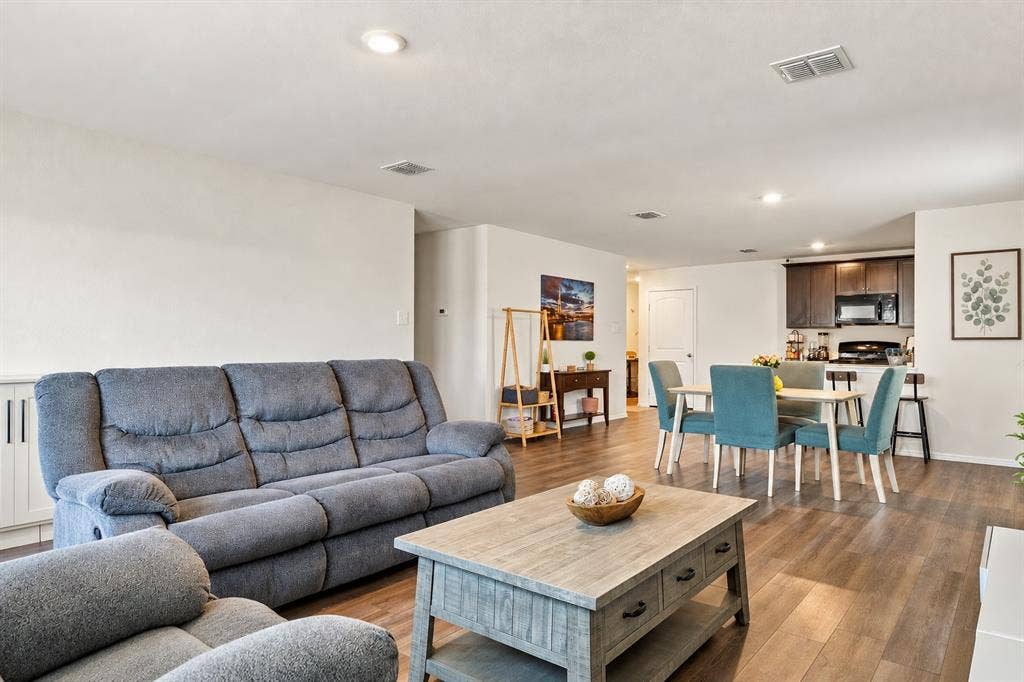 1516 Stonefield Drive, Anna, TX 75409 Open concept interior featuring wood-finish flooring, recessed lighting, and kitchen cabinetry with a dark finish