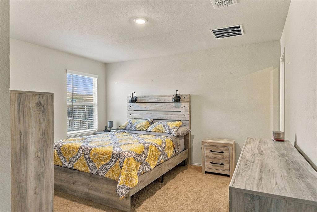 1516 Stonefield Drive, Anna, TX 75409 Neutral-toned walls, recessed lighting, and a single-hung window with horizontal blinds