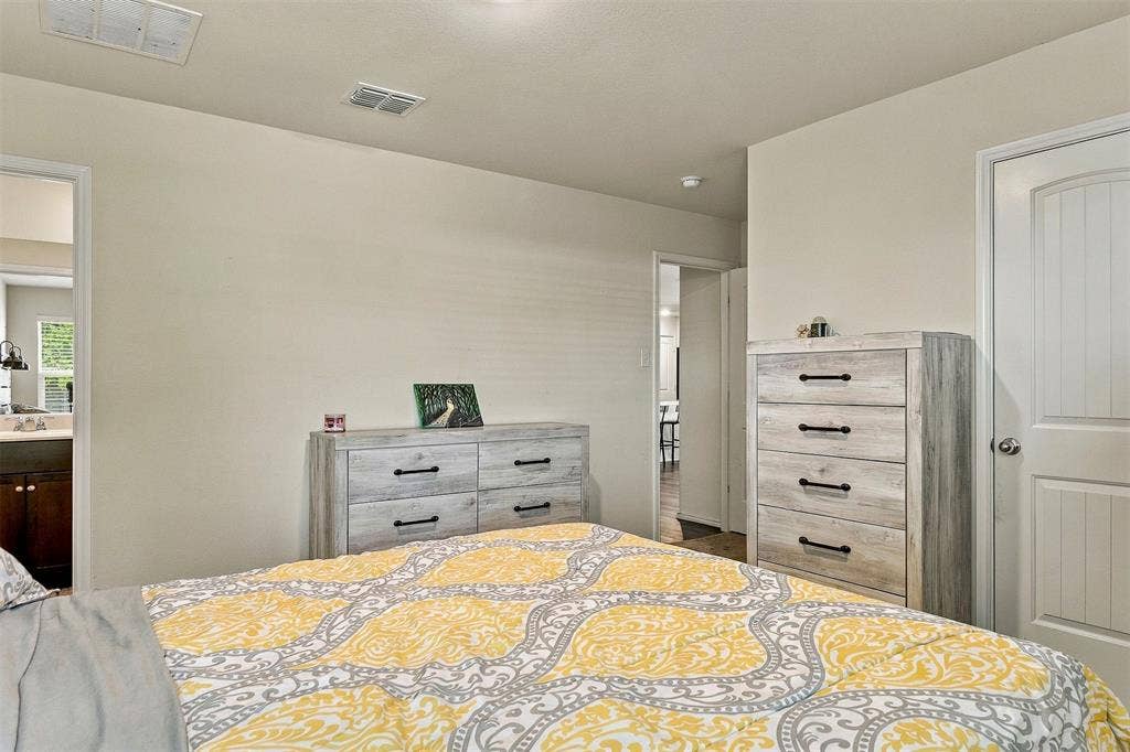 1516 Stonefield Drive, Anna, TX 75409 Interior space featuring neutral wall paint, smooth-finish ceiling, and a paneled interior door