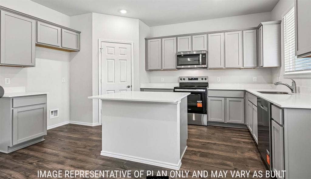 11813 Ceres Street, Lorena, TX 76655 Kitchen featuring shaker-style cabinetry, quartz countertops, a central island, stainless steel appliances, and wood-finish flooring