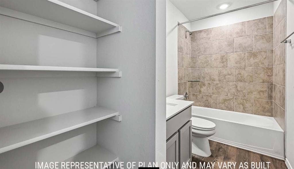 11813 Ceres Street, Lorena, TX 76655 Built-in shelving, vanity with stone-style countertop, tub-shower combination with tile surround, and wood-finish flooring